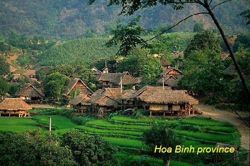 Mai Chau from Hanoi 2026 | Travel Guide, Transfer & Things To Do Panoramic view of Mai Chau valley from Thung Khe mountain pass showing lush green rice terraces and limestone karst mountains