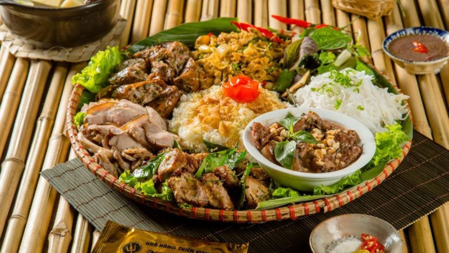 SaPa Best Things To Do A spread of Sapa highland dishes — grilled meats, sticky rice, and fresh mountain greens
