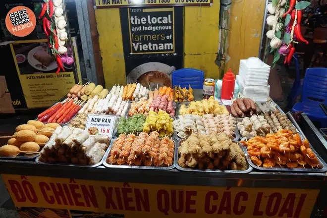 Hanoi best things to do & travel guide Vietnamese street food phở being prepared at a sidewalk stall in Hanoi