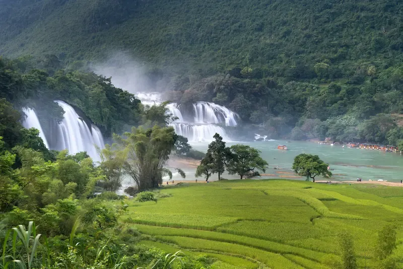 Mai Chau from Hanoi 2026 | Travel Guide, Transfer & Things To Do Thung Khe mountain pass viewpoint overlooking the entire Mai Chau valley below with winding road through limestone mountains