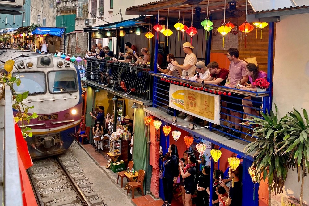 Hanoi best things to do & travel guide Hanoi Train Street with railway tracks running through narrow residential street