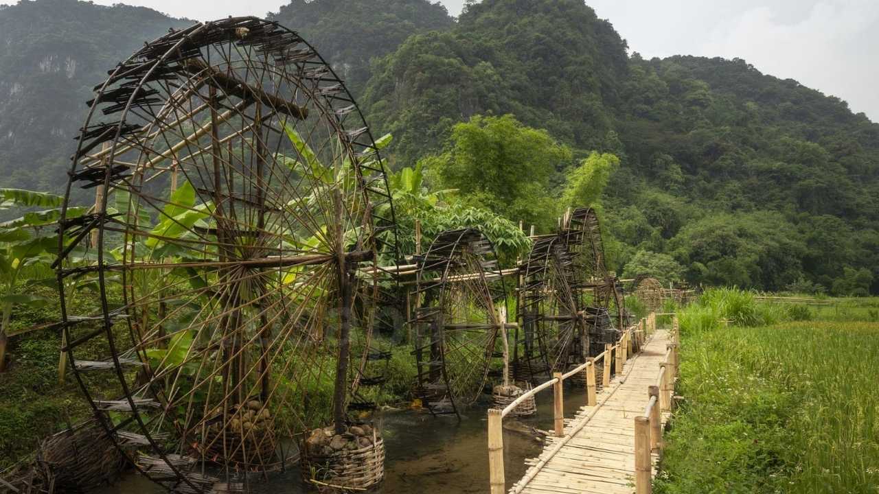 Pu Luong Travel Guide 2026: 8 Highlights, Best Time & Tours from Hanoi Traditional bamboo water wheels along stream in Pu Luong