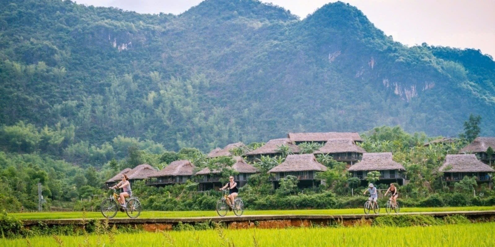 Mai Chau from Hanoi 2026 | Travel Guide, Transfer & Things To Do Modern air-conditioned limousine van on mountain road from Hanoi to Mai Chau through Hoa Binh Province Vietnam