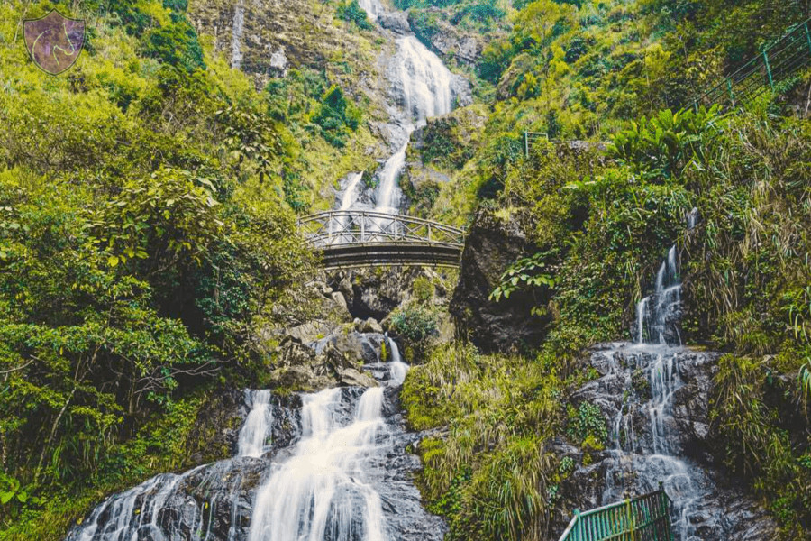 SaPa Best Things To Do Silver Waterfall (Thac Bac) cascading down a rocky cliff near Sapa