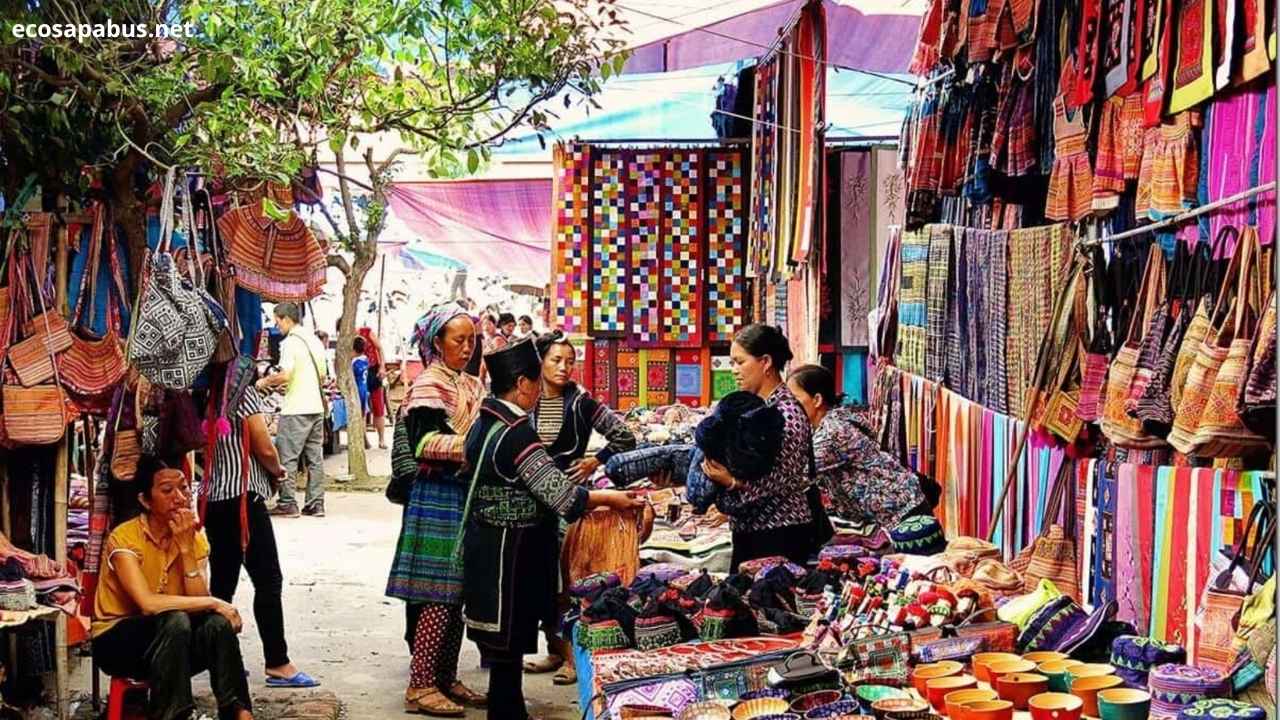 Bac Ha Sunday Market 2026 — Flower Hmong women with colorful traditional clothing at highland market in Lao Cai, North Vietnam