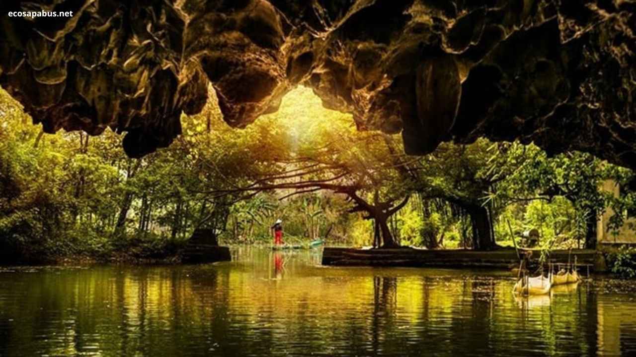 Tam Coc Ninh Binh Vietnam — rowboat through limestone karst cave tunnel river