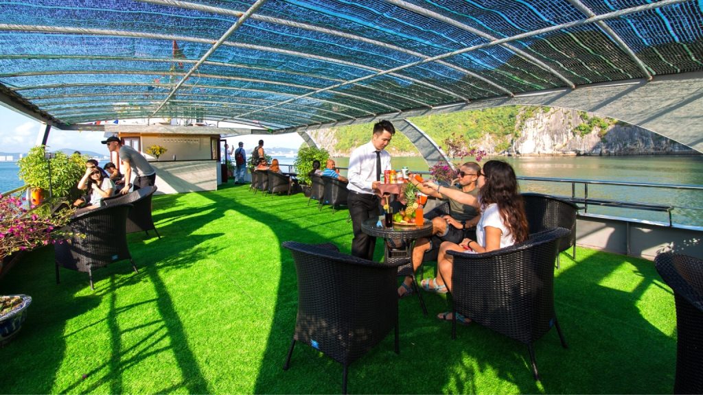 Alova Premium Cruise sundeck and outdoor seating overlooking Halong Bay