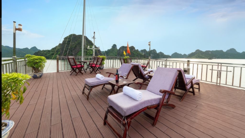 Amanda Legend Cruise sundeck and outdoor seating overlooking Halong Bay / Bai Tu Long Bay