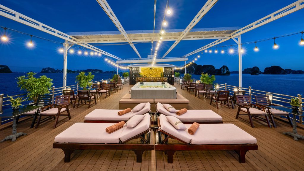 Athena Royal Cruise sundeck and outdoor seating overlooking Bai Tu Long Bay