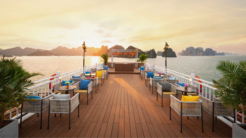 Cozy Bay Grand Cruise sundeck and outdoor seating overlooking Halong Bay