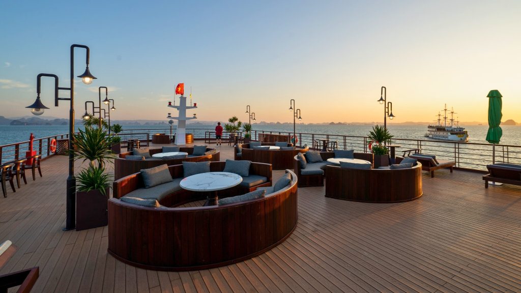 Cycad Cruise sundeck and outdoor seating overlooking Bai Tu Long Bay