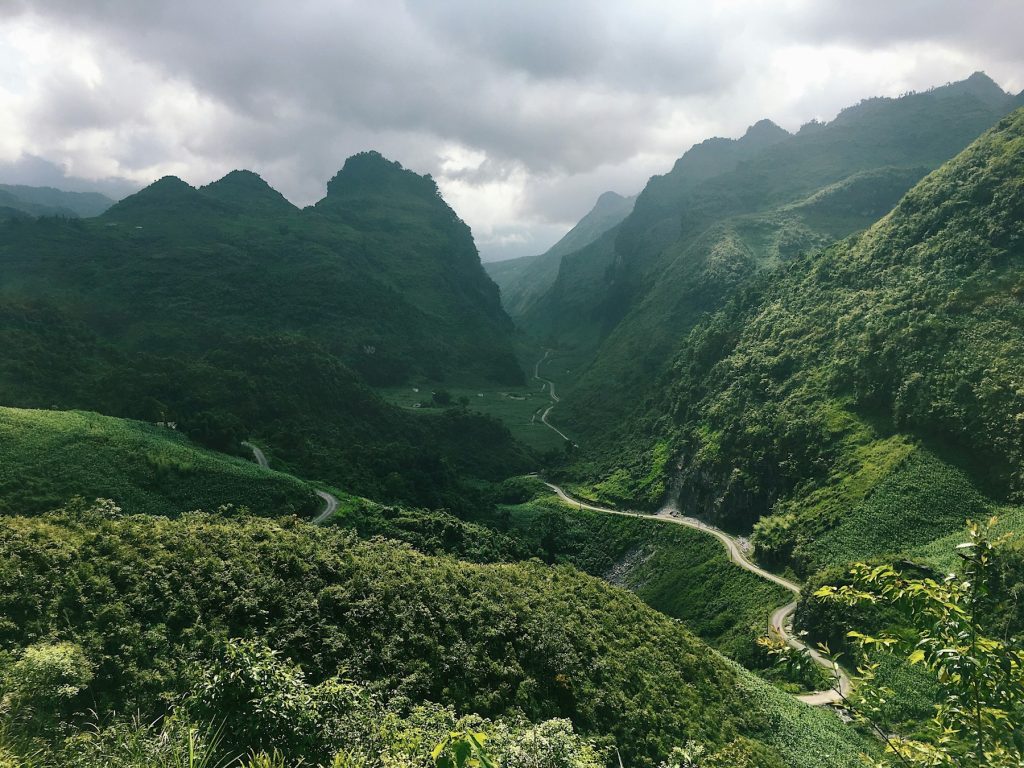 Green mountain landscape seen during a Ha Giang motorbike journey