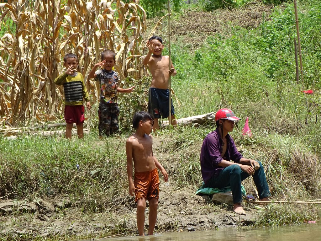 Local people by the shore of Ba Be Lake in northern Vietnam