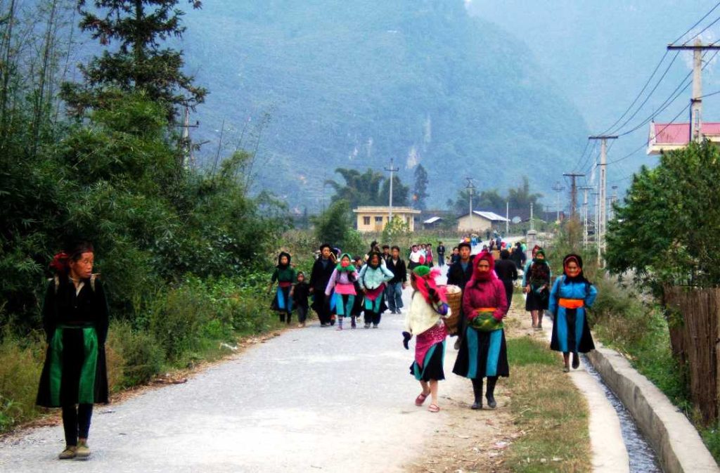 Local people travelling to market in Pho Cao, Ha Giang