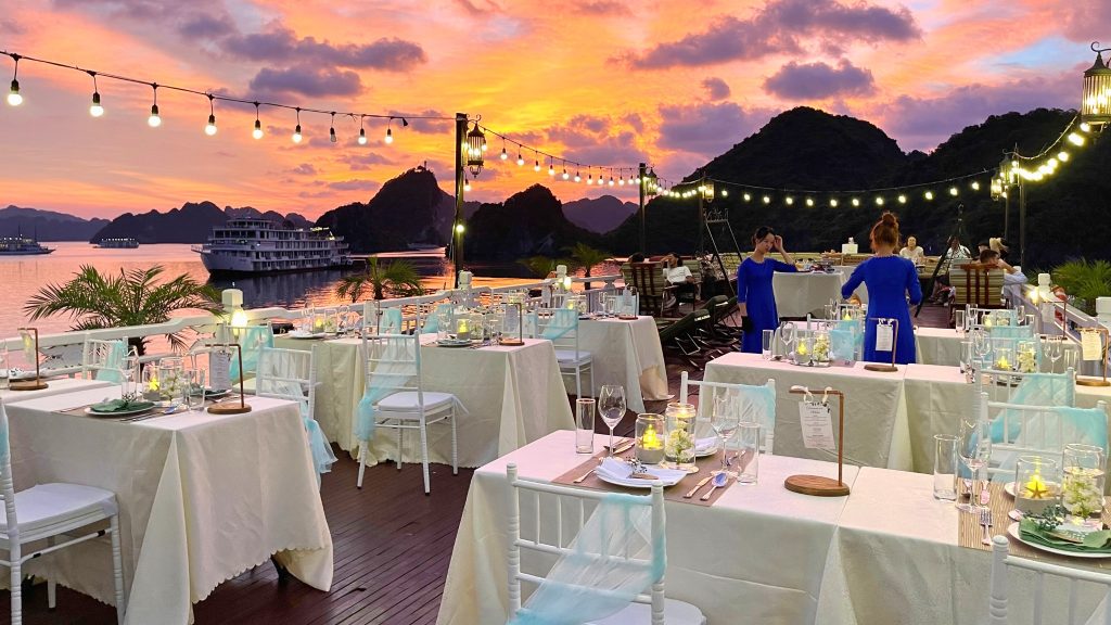 Hera Grand Luxury Cruise sundeck and outdoor seating overlooking Halong Bay