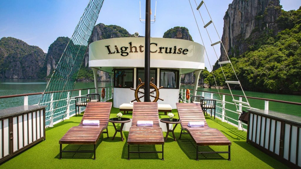 Light Day Cruise sundeck and outdoor seating overlooking Halong Bay