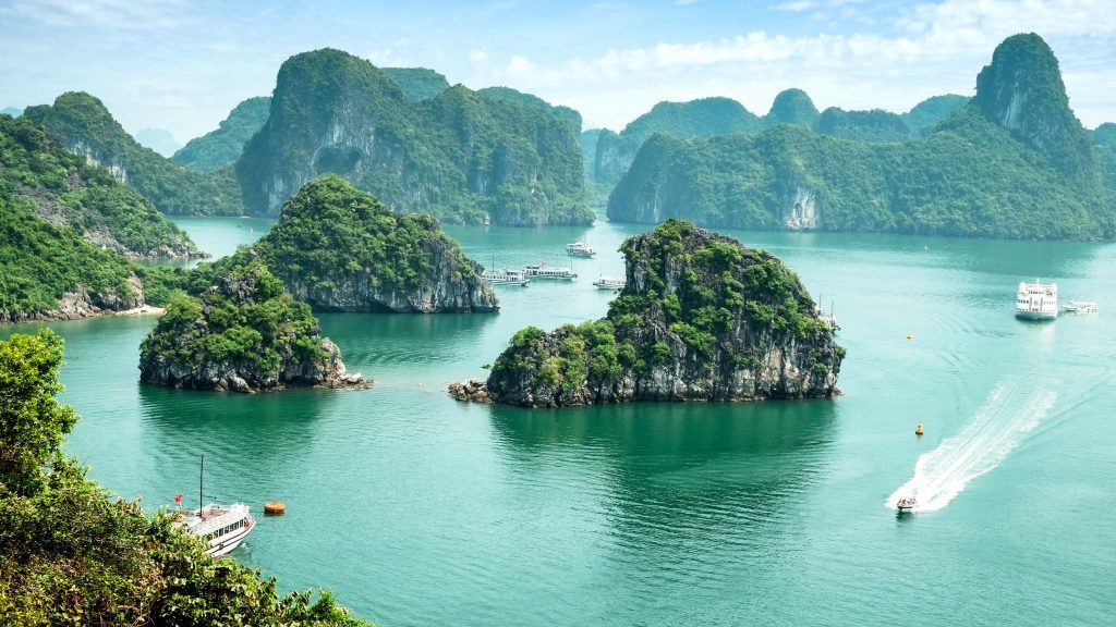 Marvel At The Iconic Limestone Islands Rising From The Emerald Waters In Ha Long Bay