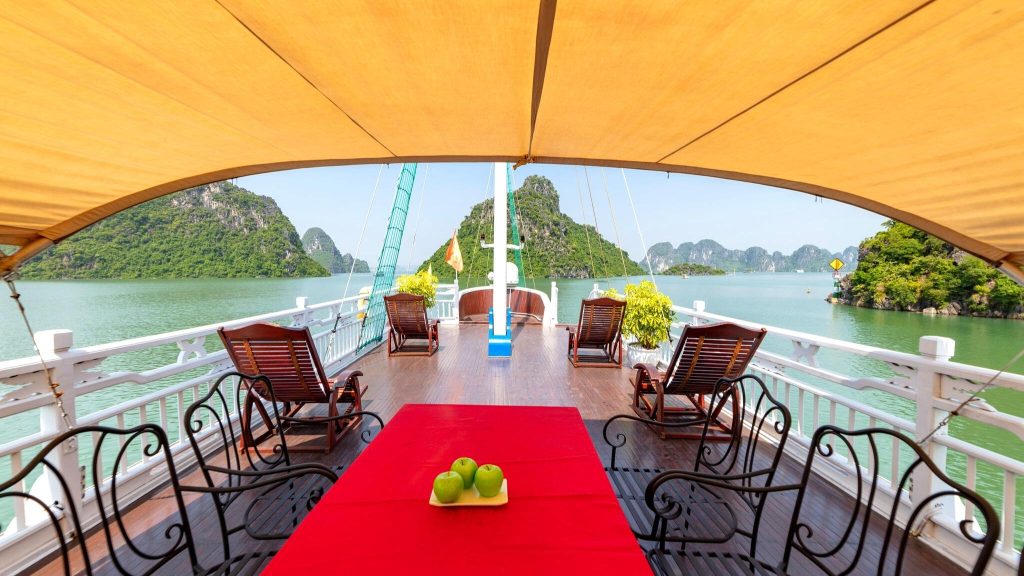 Melody Private Cruise sundeck and outdoor seating overlooking Halong Bay