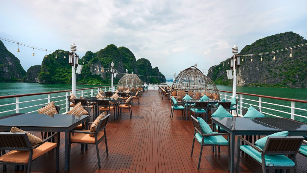 Paradise Delight Cruise sundeck and outdoor seating overlooking Halong Bay