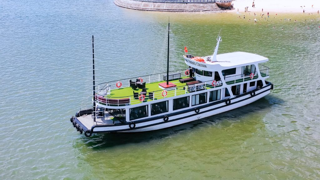 Phoenix Day Cruise sailing through Halong Bay