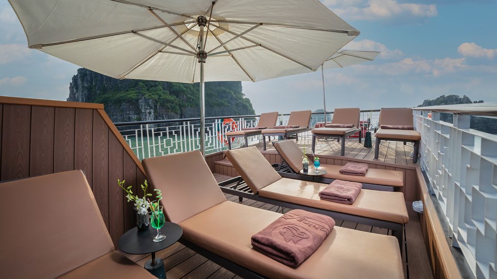 Prince Private Cruise sundeck and outdoor seating overlooking Bai Tu Long Bay