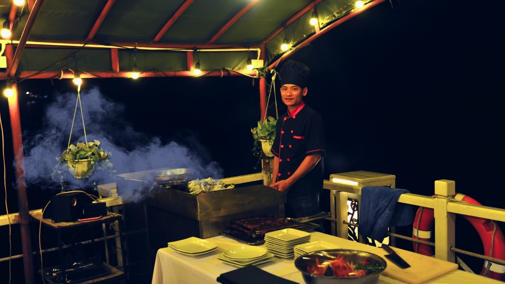 Renea Cruise sundeck and outdoor seating overlooking Bai Tu Long Bay