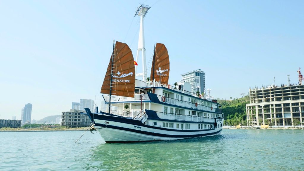 Signature Cruise sailing through Bai Tu Long Bay