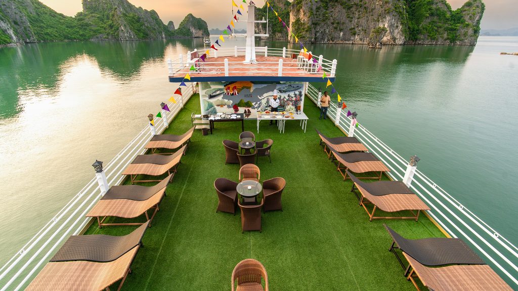 Swan Cruises sundeck and outdoor seating overlooking Bai Tu Long Bay
