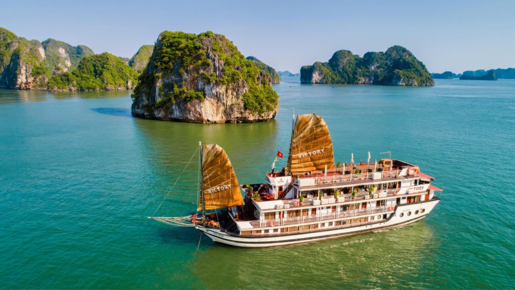 Victory Cruise sailing through Halong Bay